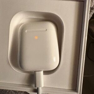 Apple AirPod 2nd Gen with charging case. Left AirPod